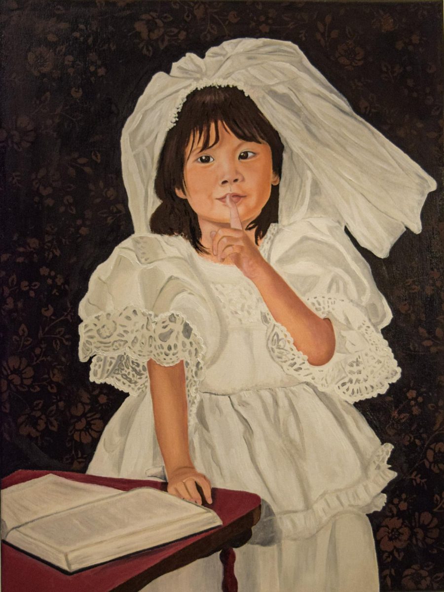 This portrait captures the quiet yet profound essence of childhood innocence and faith. The subject, a six-year-old girl, is dressed in a delicate white gown with intricate lace details, evoking the purity and reverence of a sacred moment. Her gentle expression and playful yet intentional gesture—her finger pressed to her lips—invite the viewer into a world of quiet contemplation and unspoken wisdom.
The presence of the open book, possibly a Bible, suggests a connection to faith and knowledge. Rather than simply depicting a child at play, this piece reflects the interplay between innocence and spirituality. The dark, subtly textured background contrasts with the brilliance of her dress, symbolizing the light of purity against the complexities of the world.
Inspired by the delicate balance between realism and symbolism, I sought to convey more than a likeness; I wanted to capture a feeling—a fleeting moment of serenity and introspection. This painting serves as a testament to the beauty of childlike faith, the unguarded wonder of youth, and the quiet strength found in simplicity.
This is not just a portrait; it is an invitation to pause, reflect, and embrace the silent yet profound truths that childhood reveals.